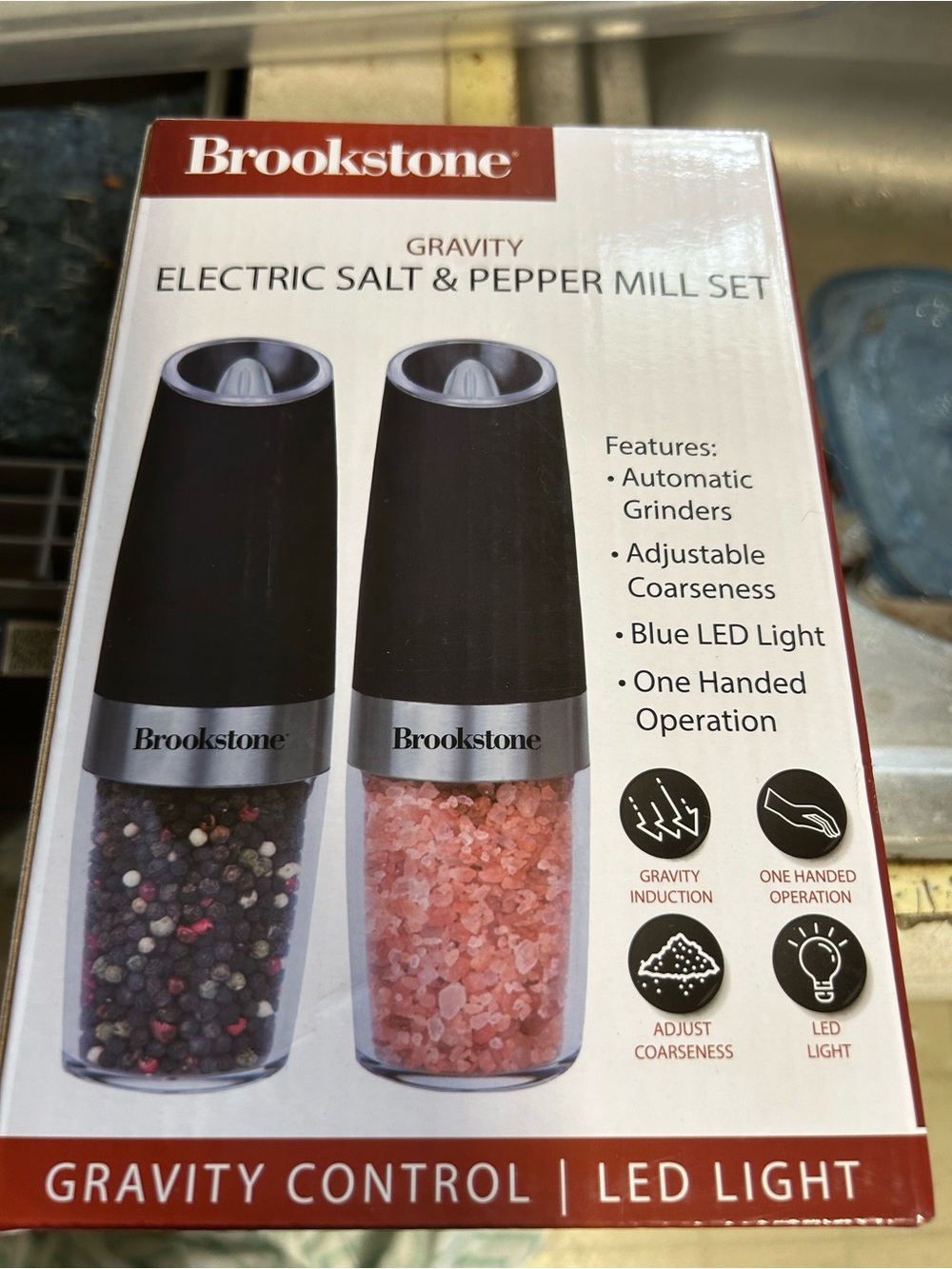 Brookstone gravity electric salt and pepper mill set features automatic